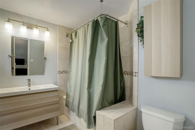 bathroom featuring toilet, shower / bath combo, tile patterned flooring, and vanity