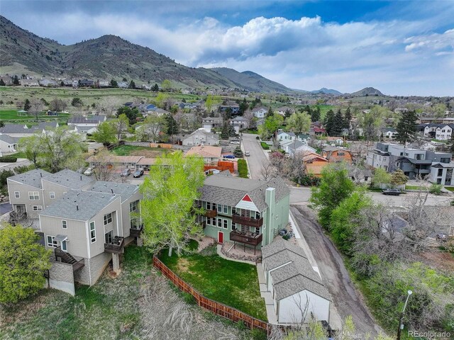 aerial view of residential area featuring mountains