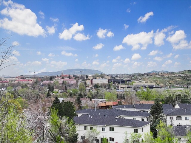 view of mountain backdrop featuring nearby suburban area