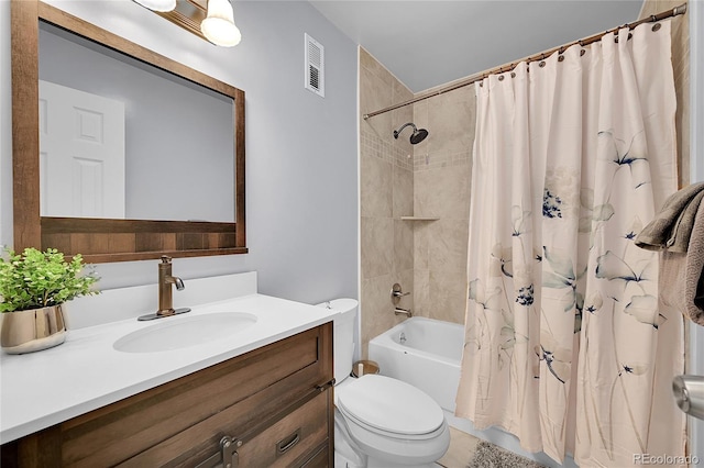 full bathroom featuring vanity, toilet, and shower / tub combo with curtain