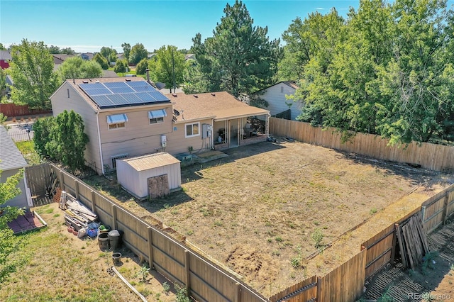 exterior space featuring a storage shed and solar panels