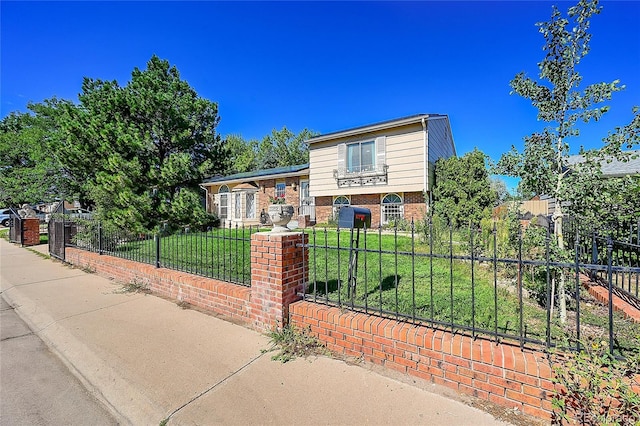 tri-level home featuring a front yard