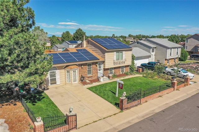 view of front facade featuring a front yard and solar panels