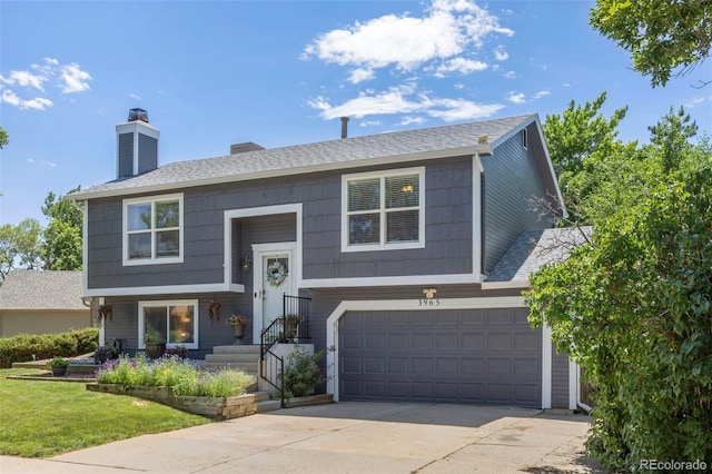 3965 S Fundy Cir, Aurora, CO 80013 - bi-level home featuring a garage, a chimney, and driveway