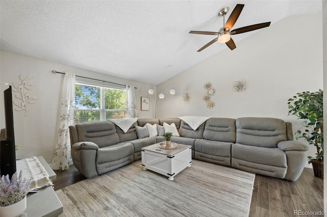 3965 S Fundy Cir, Aurora, CO 80013 - living area with vaulted ceiling, wood finished floors, ceiling fan, and a textured ceiling