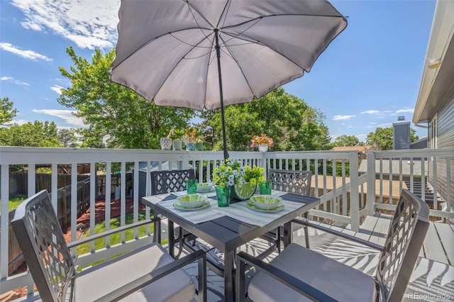 3965 S Fundy Cir, Aurora, CO 80013 - view of wooden balcony featuring outdoor dining space and a wooden deck