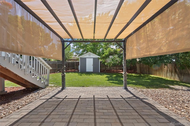 3965 S Fundy Cir, Aurora, CO 80013 - fenced backyard featuring a patio area and a storage unit
