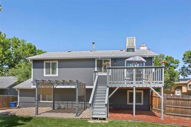 3965 S Fundy Cir, Aurora, CO 80013 - rear view of house with a wooden deck, a pergola, roof with shingles, stairs, and a chimney