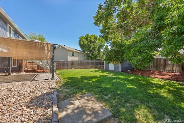 3965 S Fundy Cir, Aurora, CO 80013 - fenced backyard featuring a storage shed and stairway