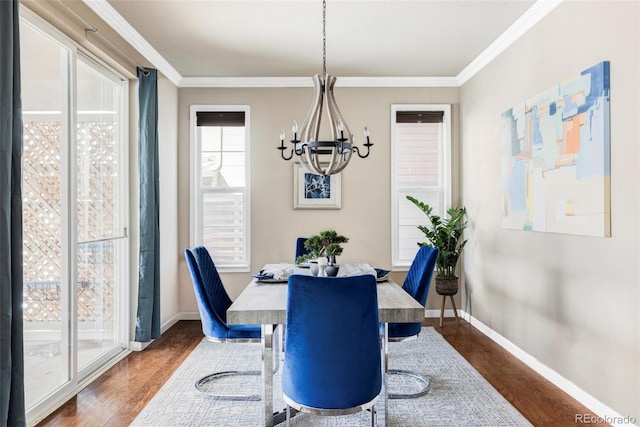 dining room with an inviting chandelier, dark wood-type flooring, and plenty of natural light