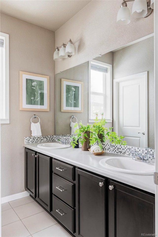 bathroom featuring vanity, backsplash, and tile patterned flooring