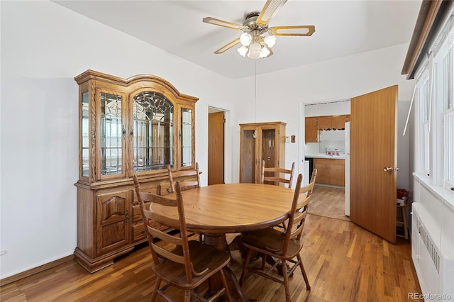 5960 Glencoe St, Commerce City, CO 80022 - dining room with a ceiling fan and light wood-style floors
