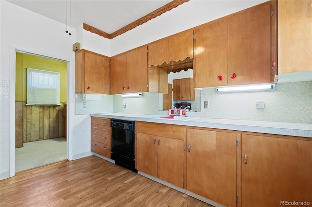 5960 Glencoe St, Commerce City, CO 80022 - kitchen with black dishwasher, a sink, light wood-style floors, light countertops, and decorative backsplash