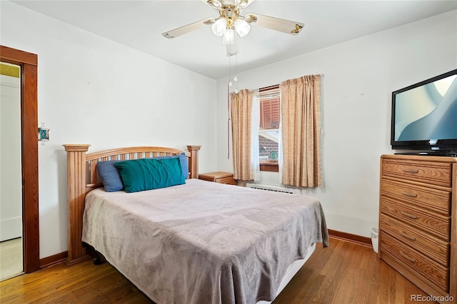 5960 Glencoe St, Commerce City, CO 80022 - bedroom featuring hardwood / wood-style floors, baseboards, and ceiling fan