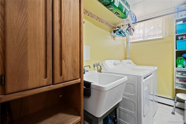 5960 Glencoe St, Commerce City, CO 80022 - washroom with independent washer and dryer, cabinet space, and baseboard heating