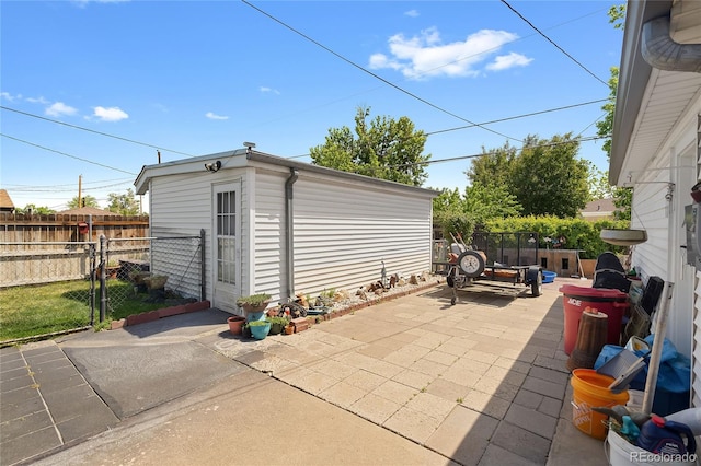 5960 Glencoe St, Commerce City, CO 80022 - view of patio with a gate and an outdoor structure