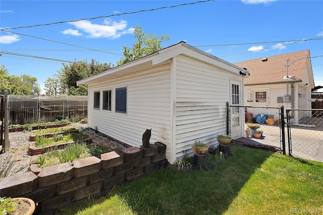5960 Glencoe St, Commerce City, CO 80022 - view of outdoor structure with a gate and a vegetable garden