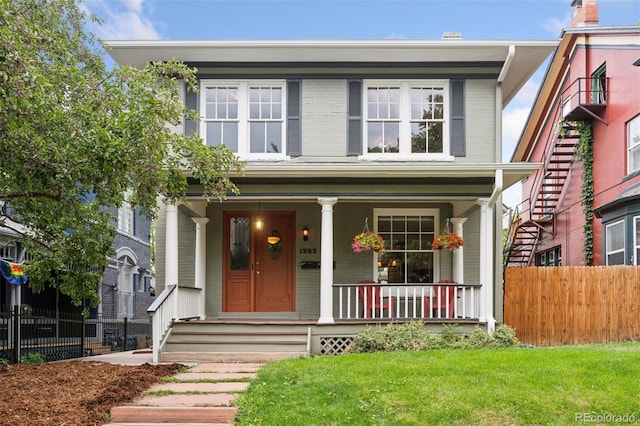 1352 N Downing St, Denver, CO 80218 - view of front of home featuring brick siding and a porch
