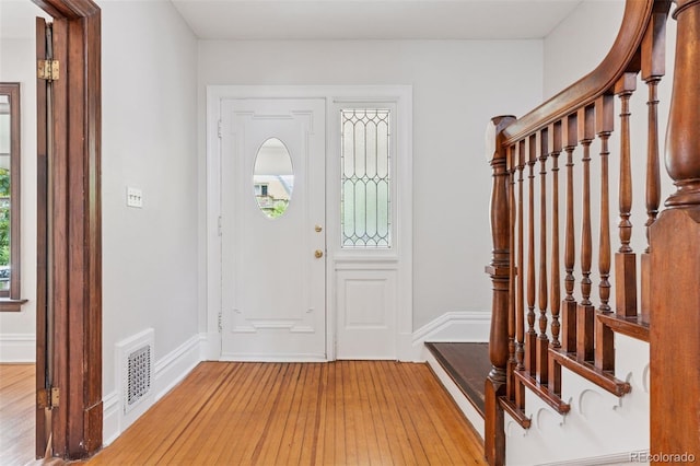 1352 N Downing St, Denver, CO 80218 - entryway featuring light wood-type flooring, plenty of natural light, and stairway
