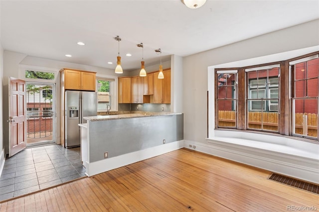 1352 N Downing St, Denver, CO 80218 - kitchen featuring stainless steel fridge, a peninsula, hardwood / wood-style floors, recessed lighting, and decorative light fixtures
