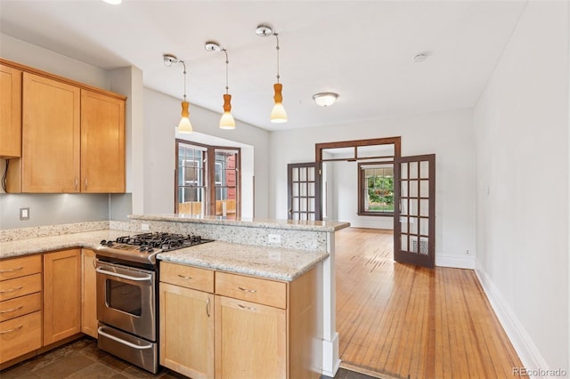 1352 N Downing St, Denver, CO 80218 - kitchen with stainless steel range with gas stovetop, a peninsula, french doors, light brown cabinetry, and light stone countertops