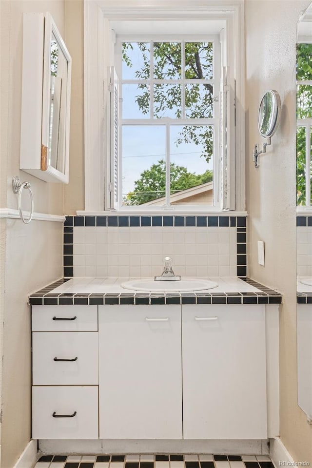 1352 N Downing St, Denver, CO 80218 - bathroom with decorative backsplash and vanity