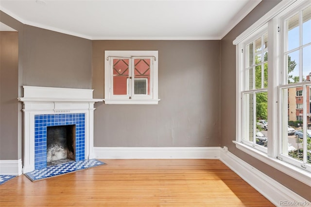 1352 N Downing St, Denver, CO 80218 - unfurnished living room with wood finished floors, a fireplace, and crown molding