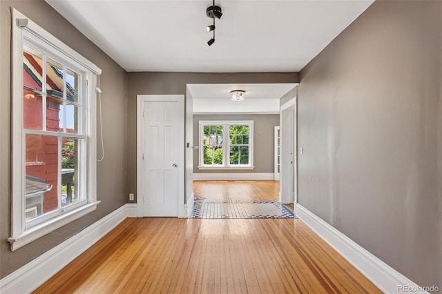 1352 N Downing St, Denver, CO 80218 - corridor with light wood finished floors and baseboards