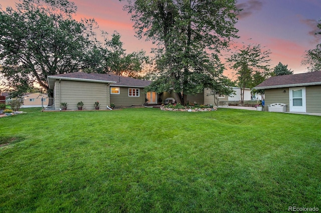 view of yard at dusk