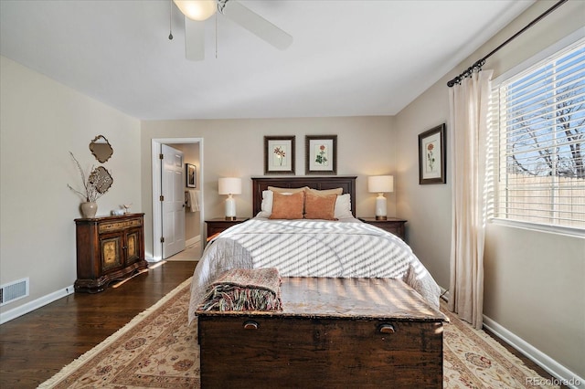 bedroom with ceiling fan and dark wood-type flooring