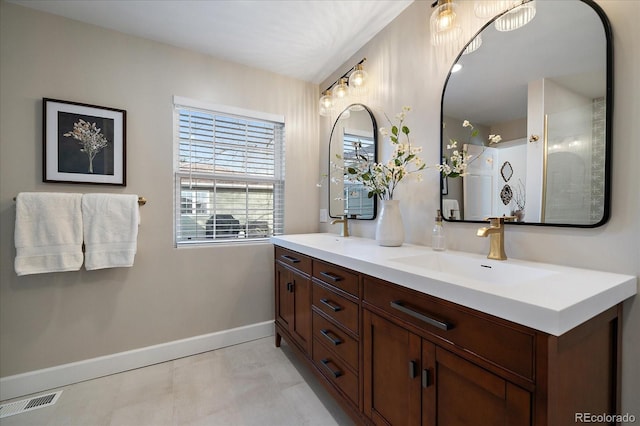 bathroom featuring walk in shower and vanity