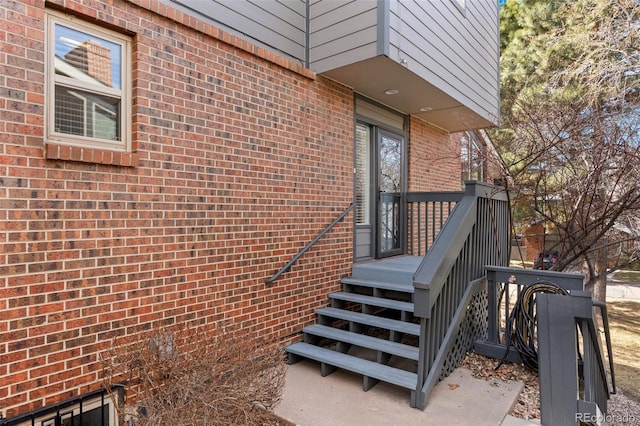 property entrance with brick siding