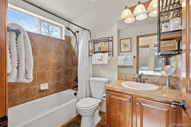 full bathroom with tile patterned flooring, vanity, shower / tub combo, and toilet