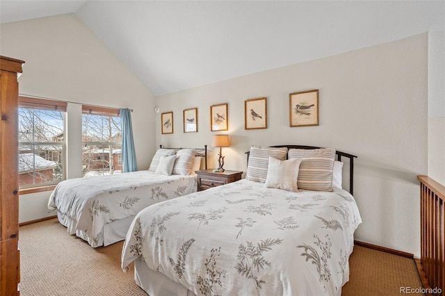 bedroom featuring light colored carpet and high vaulted ceiling