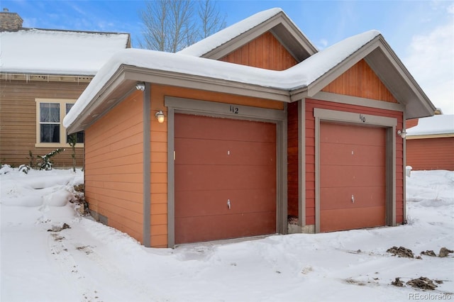 view of snow covered garage