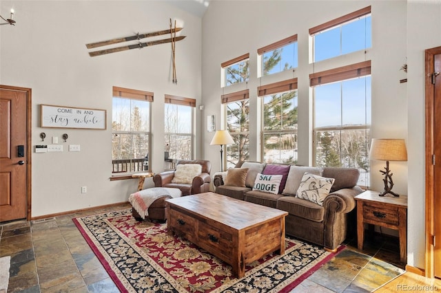 112 Deer Track Ct, Granby, CO 80446 - living room with high vaulted ceiling and stone tile floors