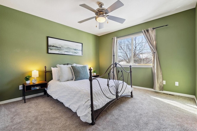 bedroom featuring a ceiling fan, carpet flooring, and baseboards