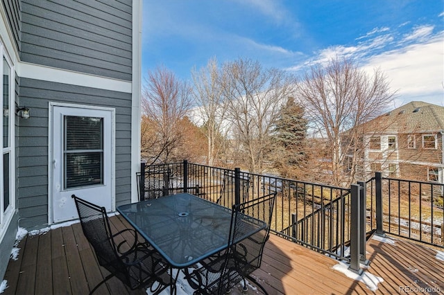 wooden terrace featuring outdoor dining space