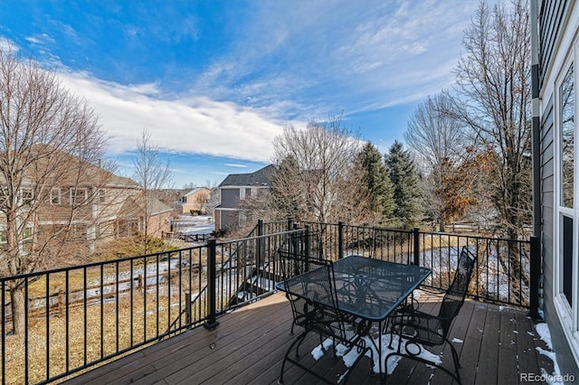 wooden terrace with outdoor dining area