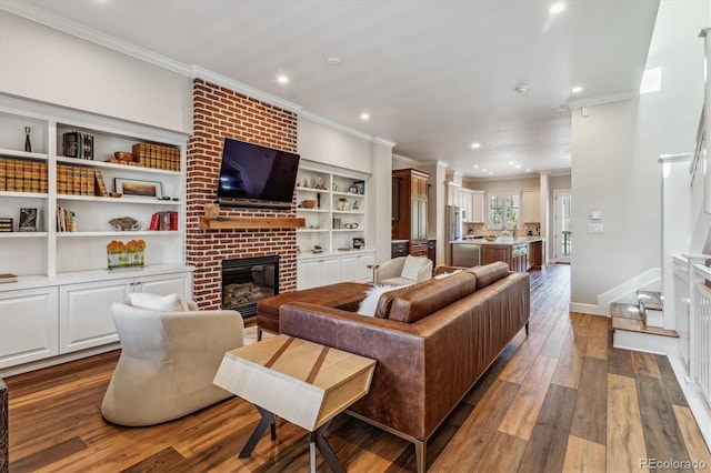 living room featuring a fireplace, dark hardwood / wood-style floors, and ornamental molding