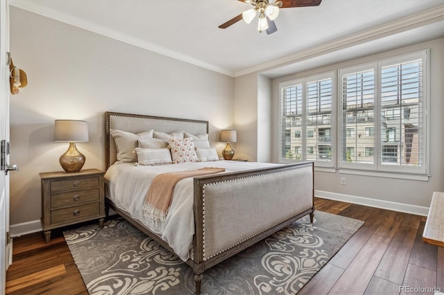 bedroom with multiple windows, ceiling fan, dark hardwood / wood-style floors, and ornamental molding