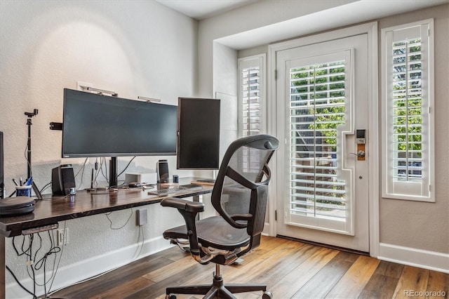 office space with hardwood / wood-style floors