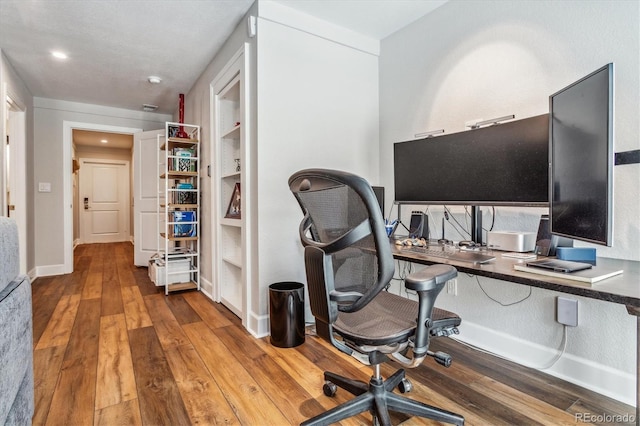 office area with hardwood / wood-style flooring