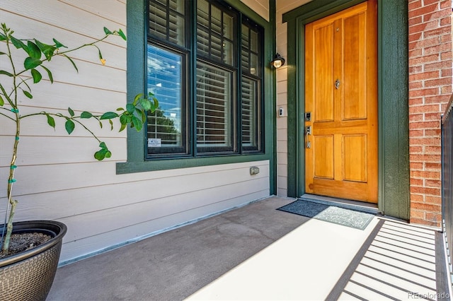 entrance to property featuring covered porch