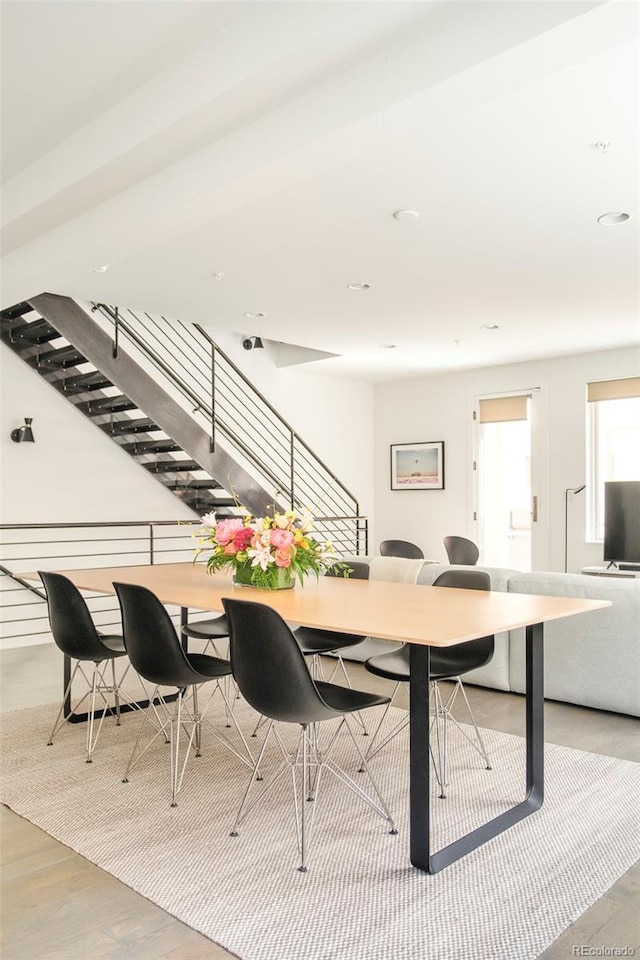 dining area with wood finished floors