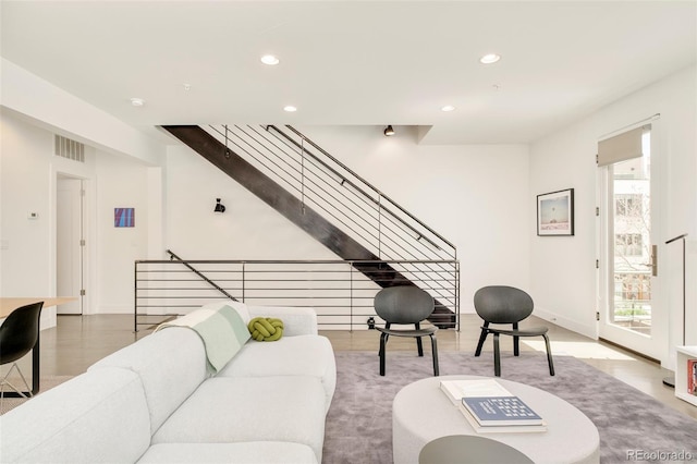 living room with plenty of natural light, recessed lighting, and visible vents