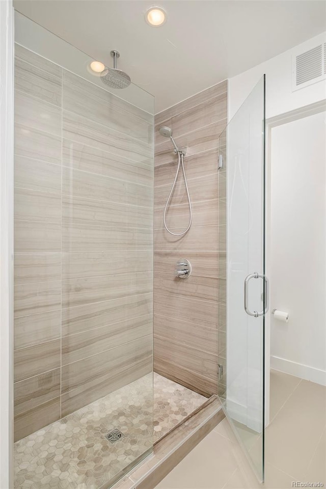 bathroom featuring tile patterned floors, a stall shower, recessed lighting, and visible vents