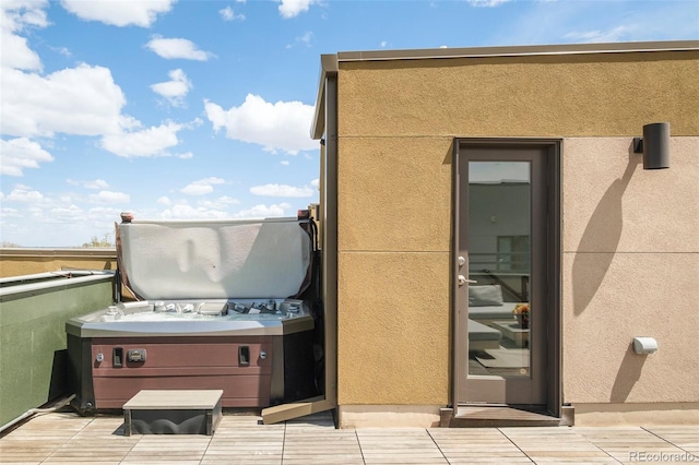exterior space featuring a hot tub