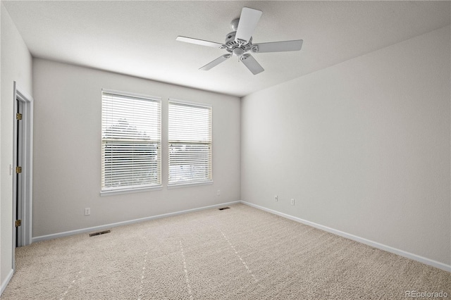 carpeted empty room with ceiling fan