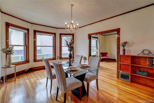 114 Cave Ave, Manitou Springs, CO 80829 - dining area featuring ornamental molding, a chandelier, light wood-type flooring, and baseboards